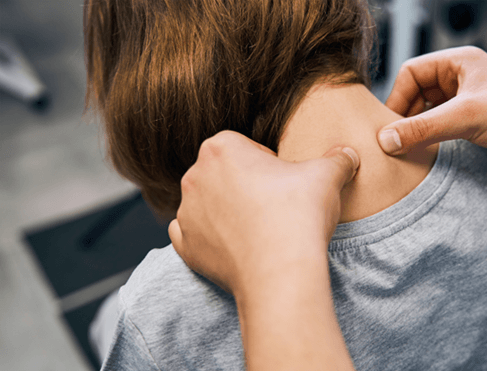 Doctor examining patient’s neck