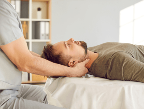 Man undergoing osteopathic treatment for neck