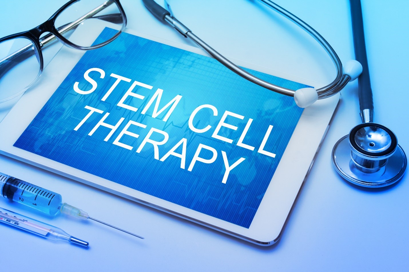 https://www.newenglandstemcells.com/blog/wp-content/uploads/2022/11/Stem-cell-therapy-written-on-electronic-tablet-surrounded-by-medical-objects.jpg